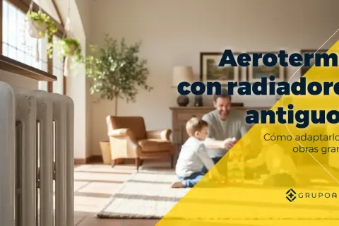 Radiador antiguo blanco en primer plano, con familia jugando al fondo. Aerotermia con calefacción por radiadores antiguos.