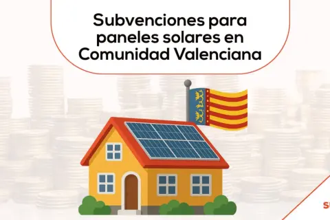 Casa con paneles solares y bandera de la Comunidad Valenciana, rodeada de pilas de monedas. ¡Infórmate sobre las ayudas autoconsumo comunidad valenciana!