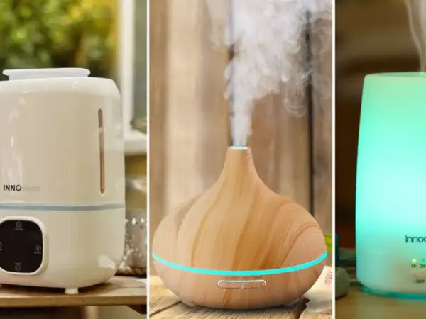 Tres dispositivos: un humidificador blanco con panel de control, un difusor de madera con vapor y un humidificador/purificador iluminado en verde.